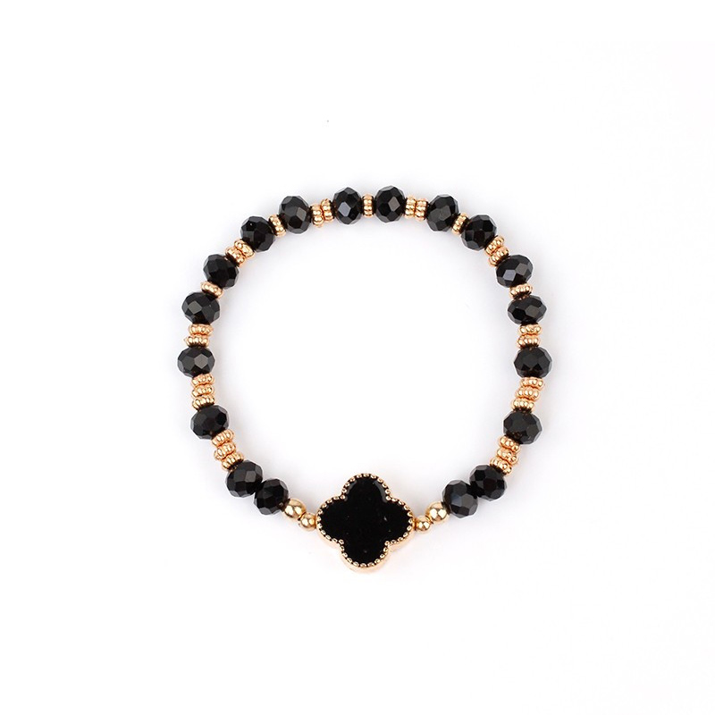 Pulsera Elastica Negra y Dorada con Trebol