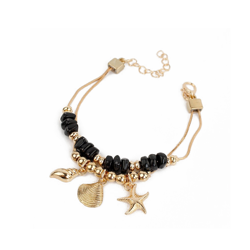 Pulsera Trendy Dorada y Negra con Dijes Dorados Caracoles