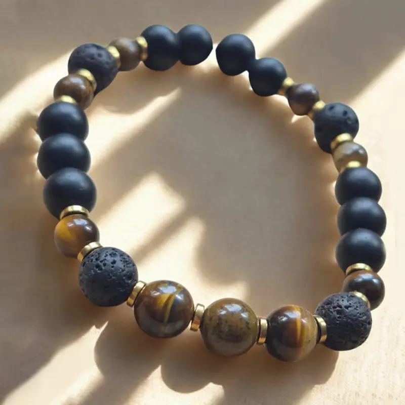 Pulsera Gema Elastica Ojo de Tigre, Onix Mate, Hematite Dorado y Piedra Volcanica