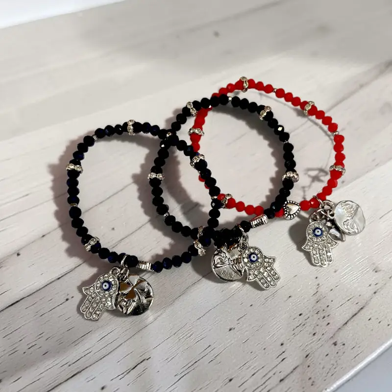 Pulsera Elastica con Dije Promesa de Meñique, Mano de Fatima y Trebol Negra