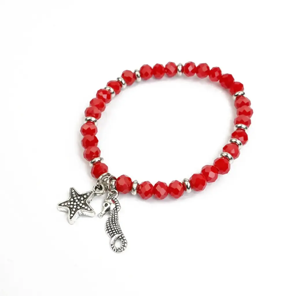 Pulsera Elastica Roja Dijes Plateados Estrella y Caballito de Mar